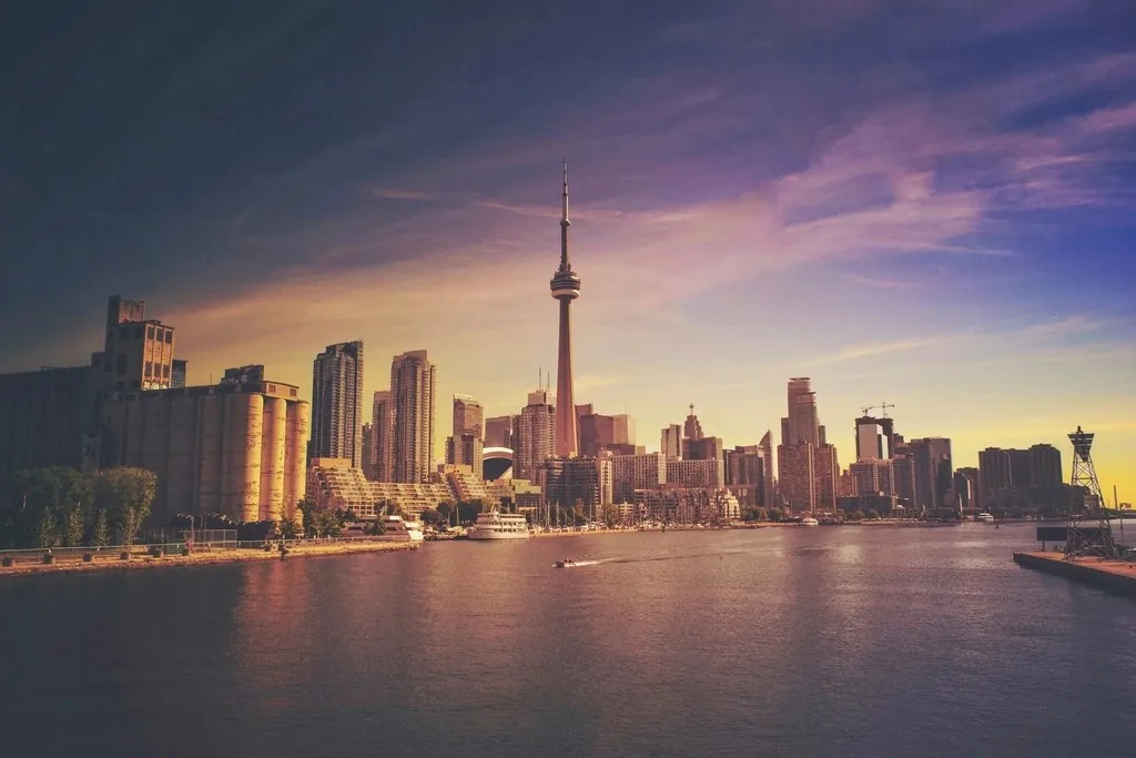 The Toronto skyline and CN Tower under a gold and violet sunset
